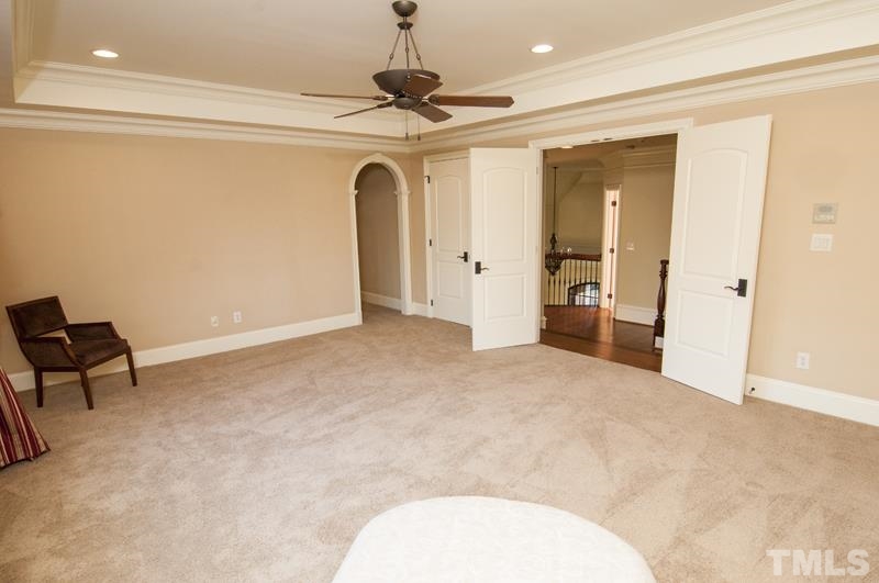 11200 Jonas Ridge Lane Raleigh, NC 27613 - Photo 15 of 25 a view of a livingroom with a ceiling fan and a chandelier