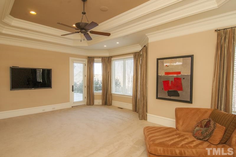 11200 Jonas Ridge Lane Raleigh, NC 27613 - Photo 5 of 25 a living room with furniture and a flat screen tv