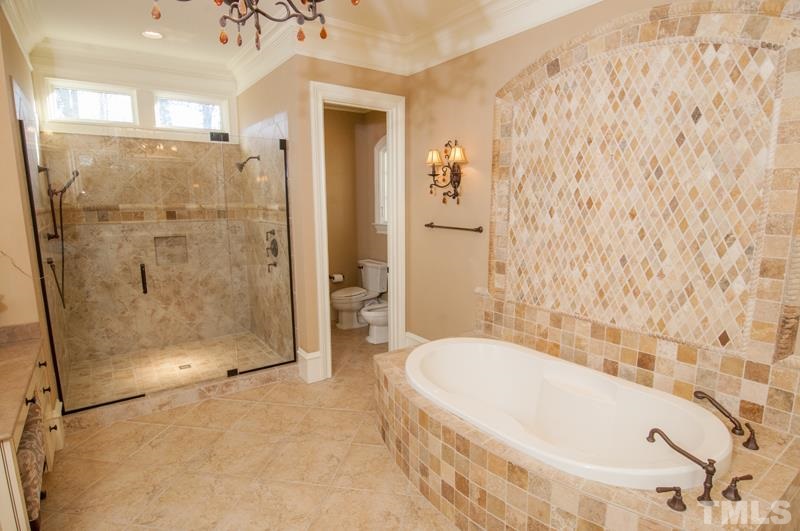 11200 Jonas Ridge Lane Raleigh, NC 27613 - Photo 6 of 25 a bathroom with a bathtub and shower