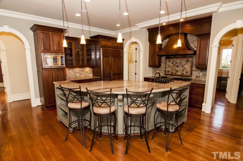 11200 Jonas Ridge Lane Raleigh, NC 27613 - Photo 8 of 25 a view of a dining room with furniture and wooden floor