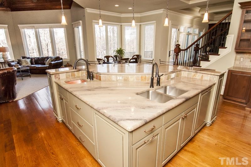11200 Jonas Ridge Lane Raleigh, NC 27613 - Photo 9 of 25 a kitchen with sink stove and cabinets