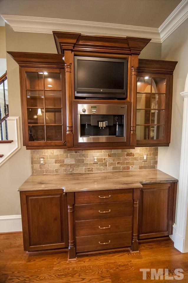 11200 Jonas Ridge Lane Raleigh, NC 27613 - Photo 10 of 25 a kitchen with a sink and a microwave