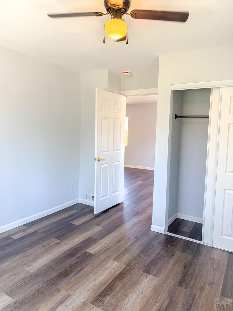 809 West 4th Street La Junta, CO 81050 - Photo 4 of 15 a view of an empty room with wooden floor