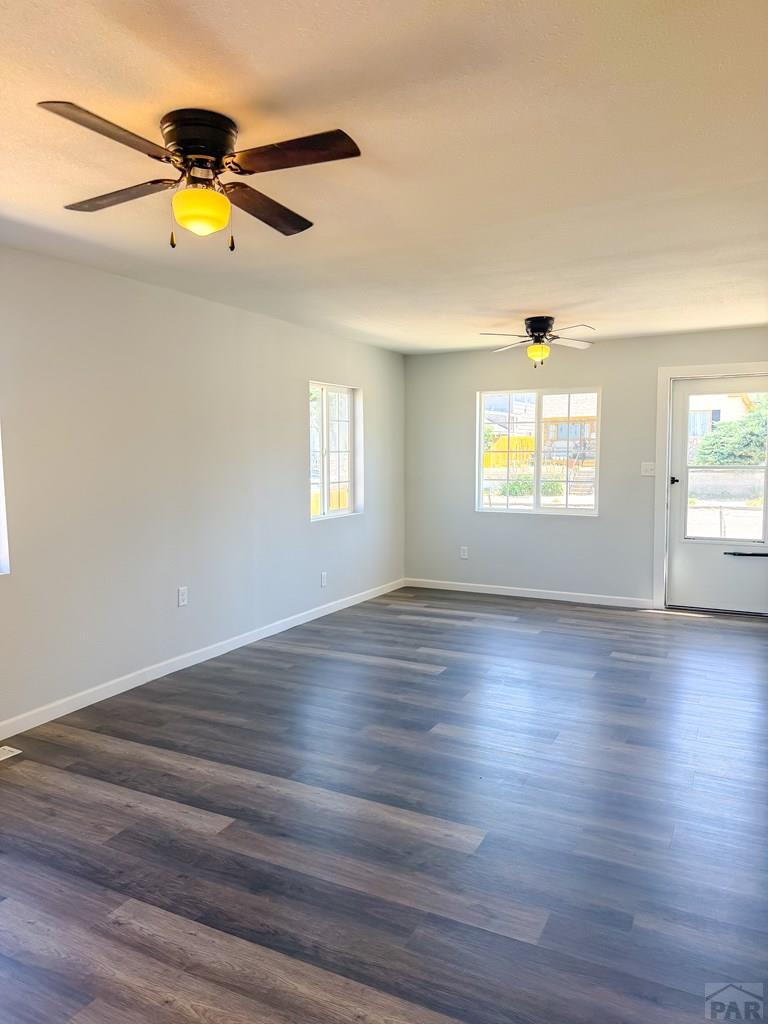 809 West 4th Street La Junta, CO 81050 - Photo 5 of 15 a view of empty room with wooden floor and fan