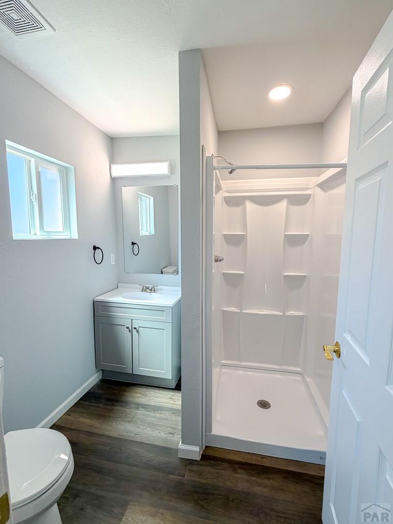 809 West 4th Street La Junta, CO 81050 - Photo 7 of 15 a bathroom with a sink a toilet and shower