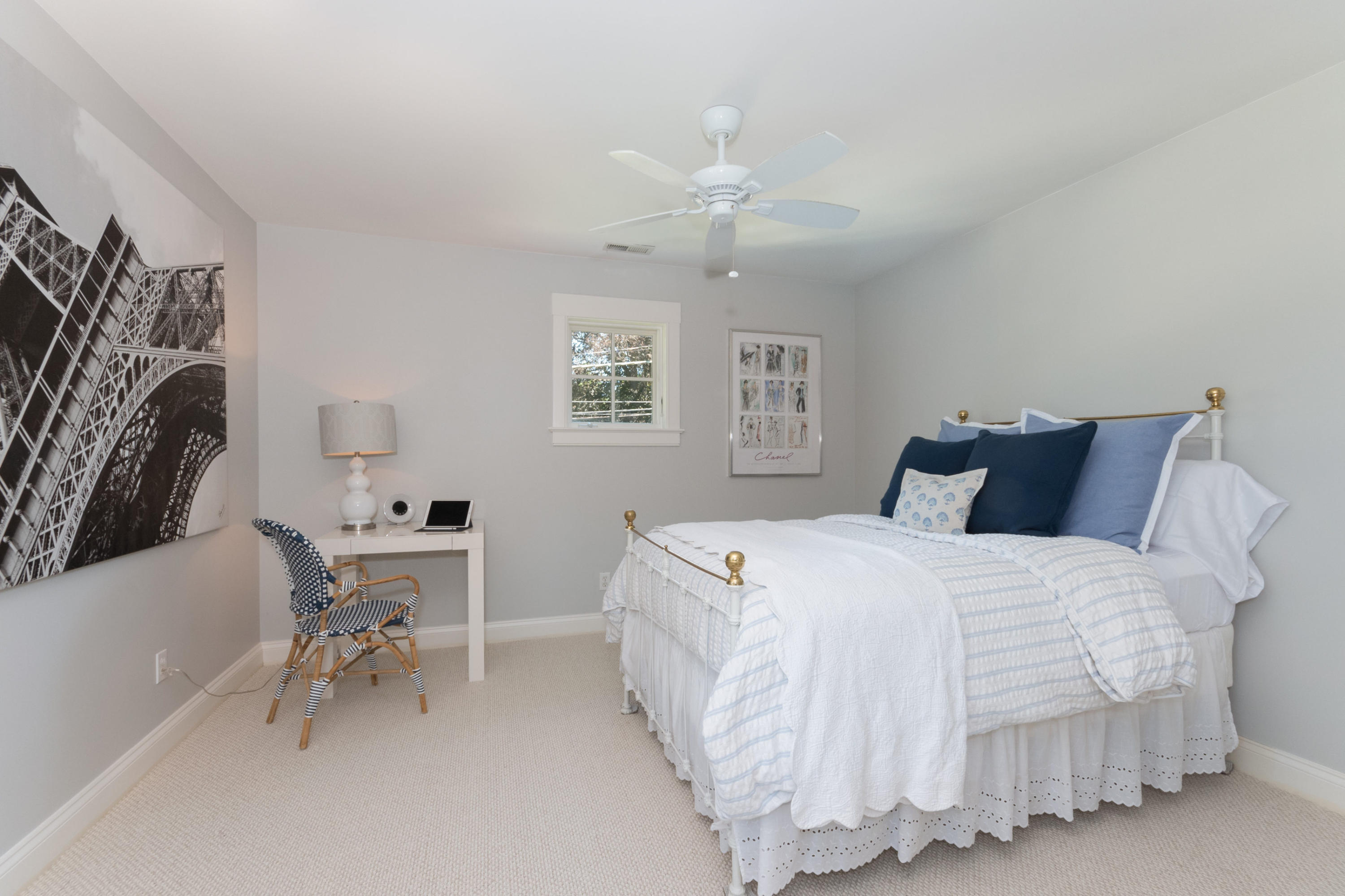 3 Seagate Road Darien, CT 06820 - Photo 30 of 48 a bedroom with a bed and a table chair