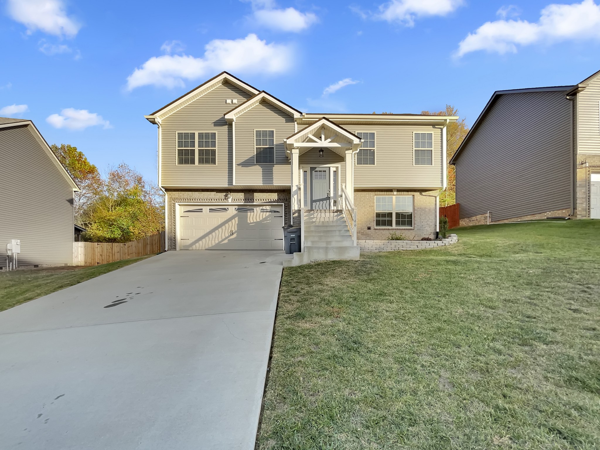 1144 Racker Drive Clarksville, TN 37043 - Photo 1 of 17 a front view of a house with garden
