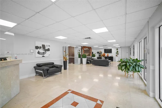 a hallway with wooden floor and stairs