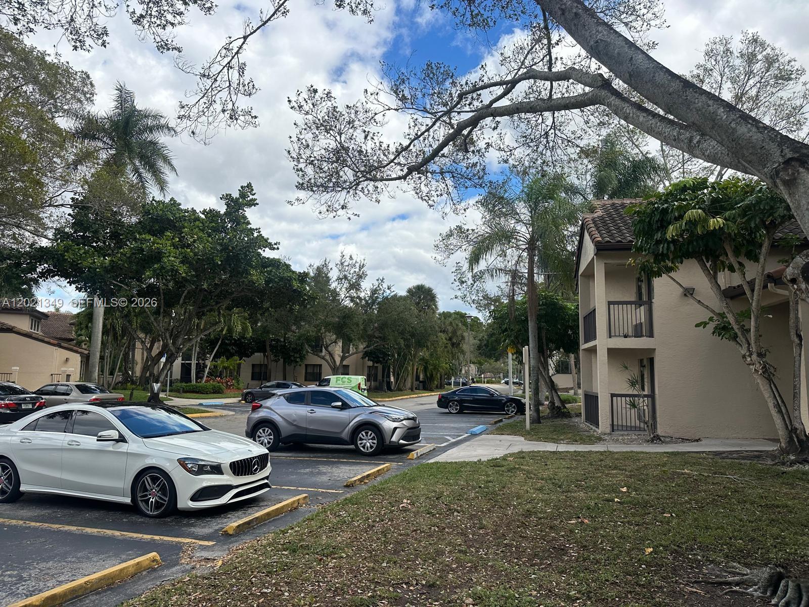 4481 West McNab Road, Unit 37 Pompano Beach, FL 33069 - Photo 4 of 20 a car parked in front of a house