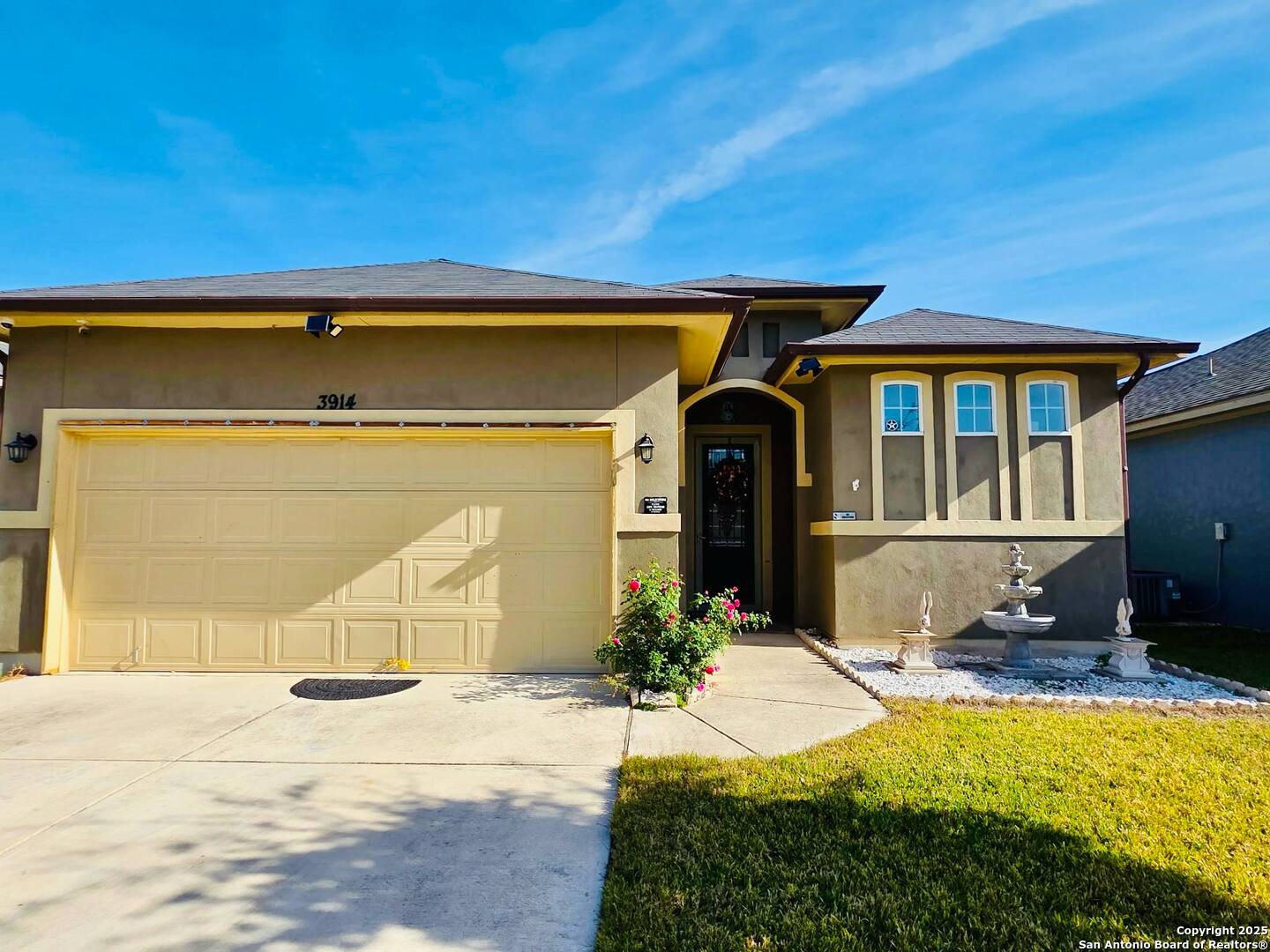 a front view of a house with a yard