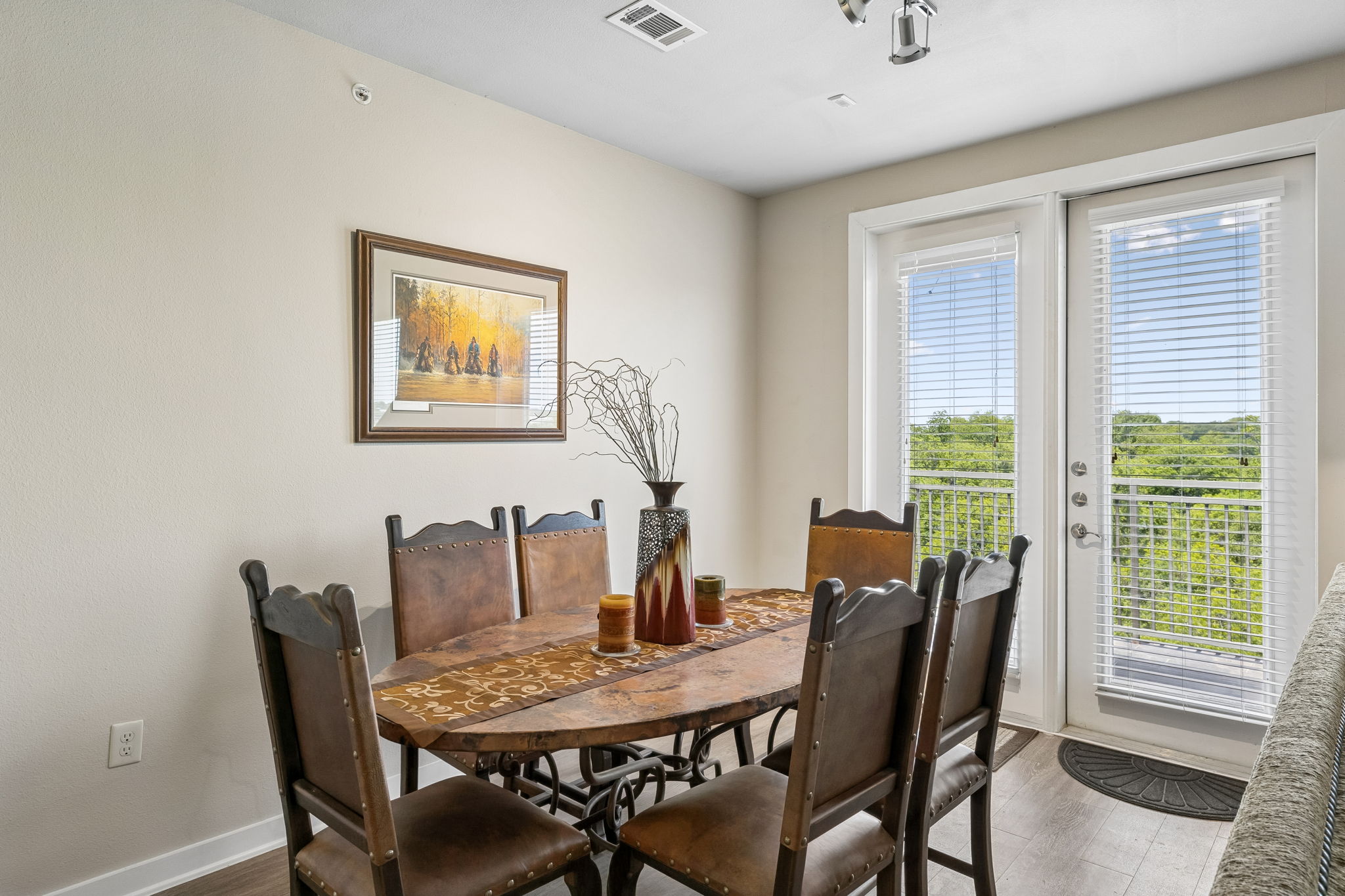 1900 Barton Springs Road, Unit 5032 Austin, TX 78704 - Photo 8 of 40 Dining area featuring wood-finish flooring and light-toned walls