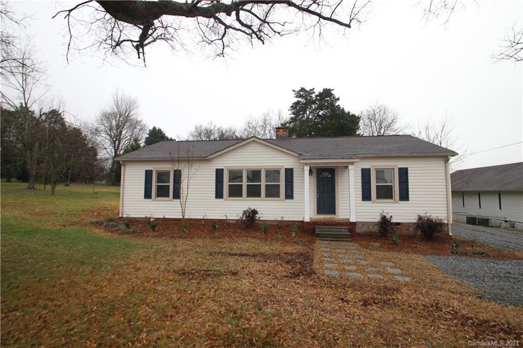 4645 Poplar Tent Road Concord, NC 28027 - Photo 1 of 25 a view of a white house with a yard