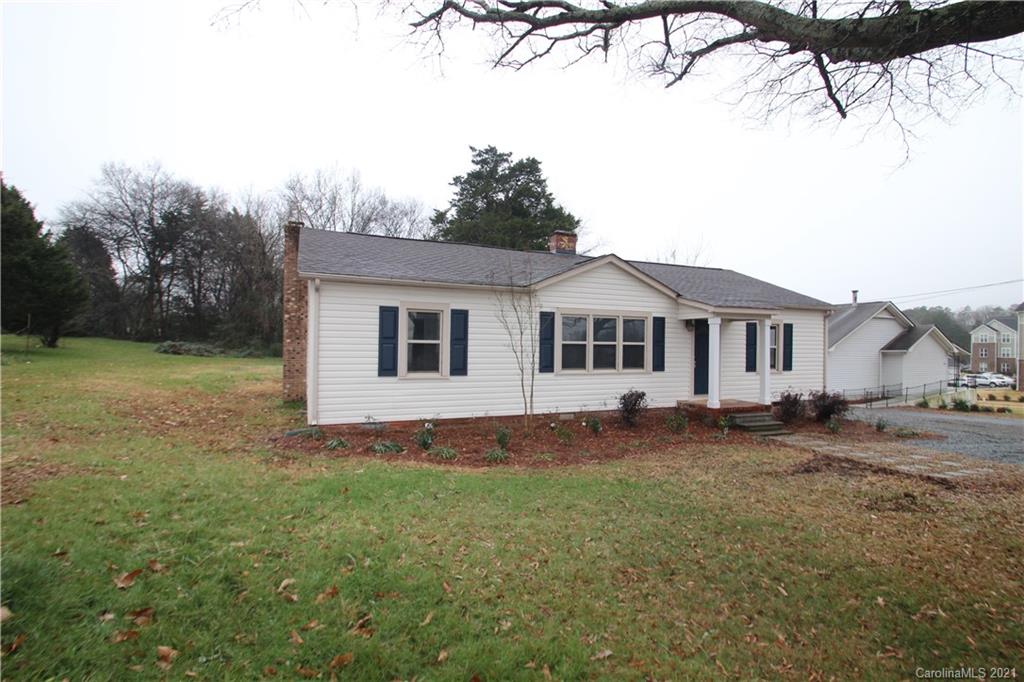4645 Poplar Tent Road Concord, NC 28027 - Photo 3 of 25 a view of a yard with a house