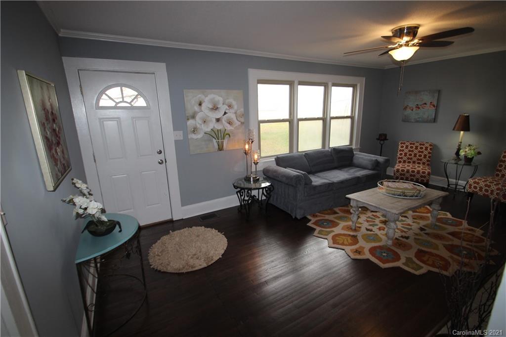 4645 Poplar Tent Road Concord, NC 28027 - Photo 5 of 25 a living room with furniture and a window