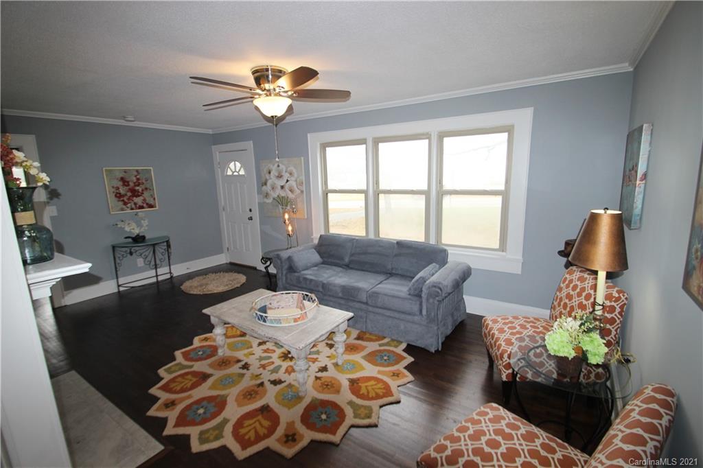 4645 Poplar Tent Road Concord, NC 28027 - Photo 7 of 25 a living room with furniture and a large window