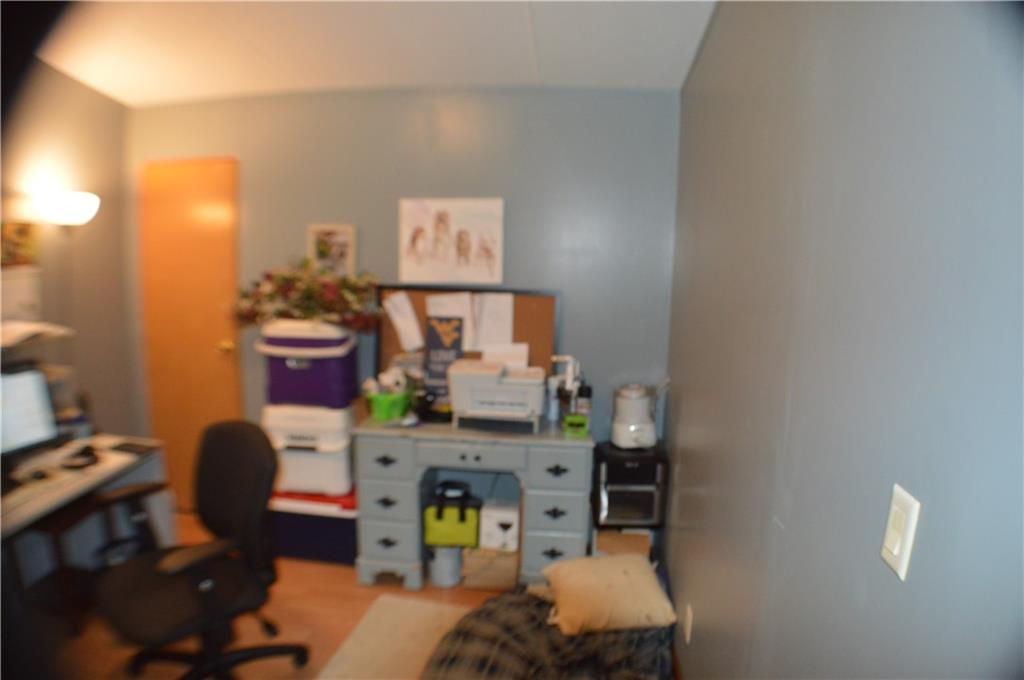 188 Cope Road Perryopolis, PA 15473 - Photo 11 of 21 a workspace with furniture and lamp
