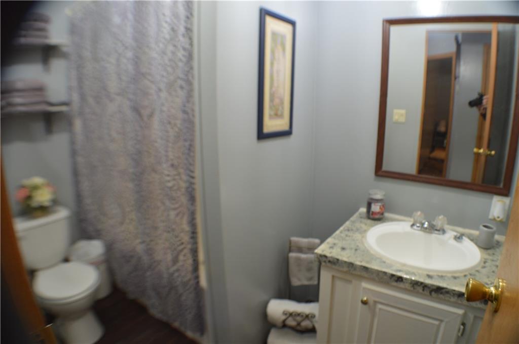 188 Cope Road Perryopolis, PA 15473 - Photo 12 of 21 a bathroom with a sink toilet and a mirror