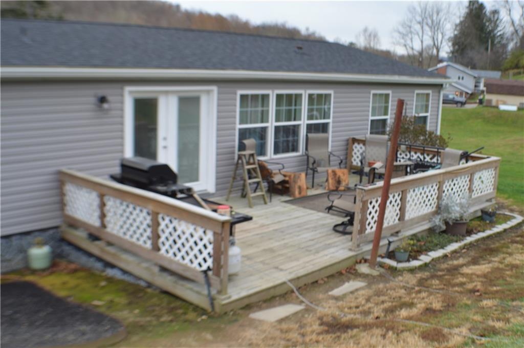 188 Cope Road Perryopolis, PA 15473 - Photo 14 of 21 a view of a deck with chairs and a yard