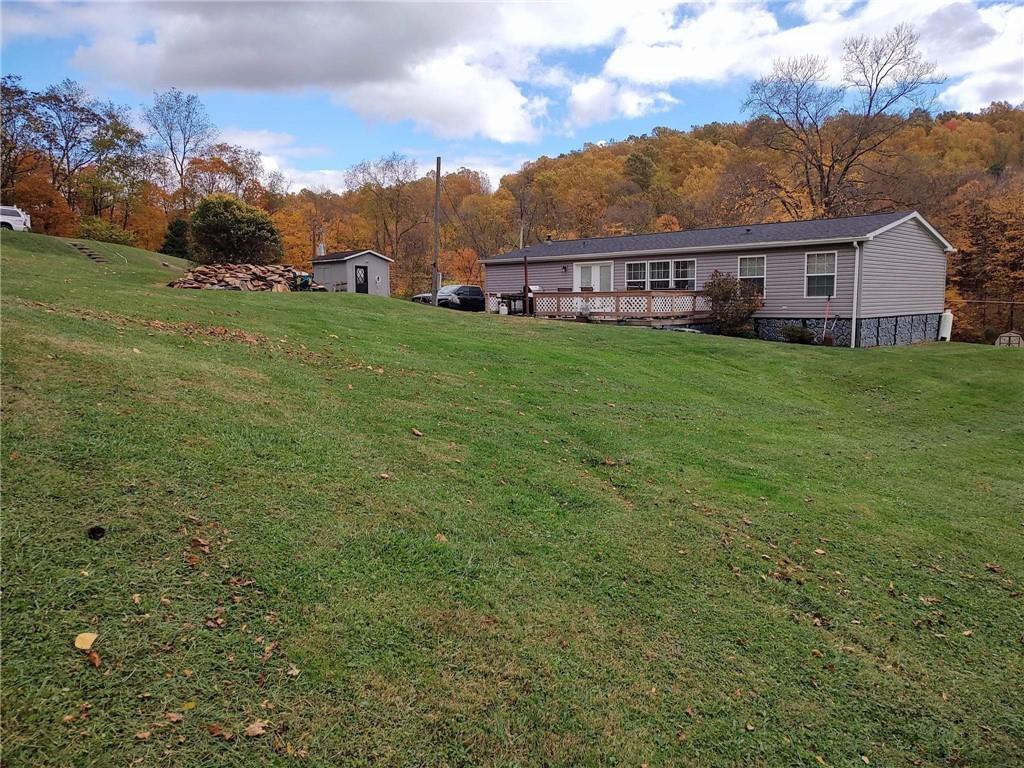 188 Cope Road Perryopolis, PA 15473 - Photo 15 of 21 a view of a house with a big yard