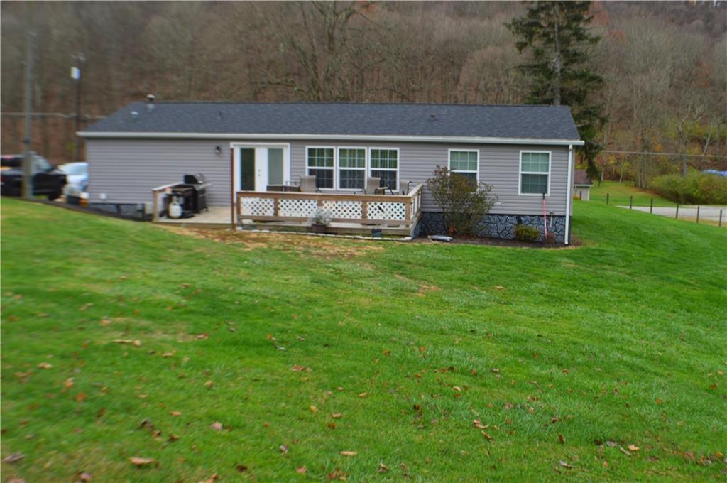 188 Cope Road Perryopolis, PA 15473 - Photo 16 of 21 a view of a house with a yard and sitting area