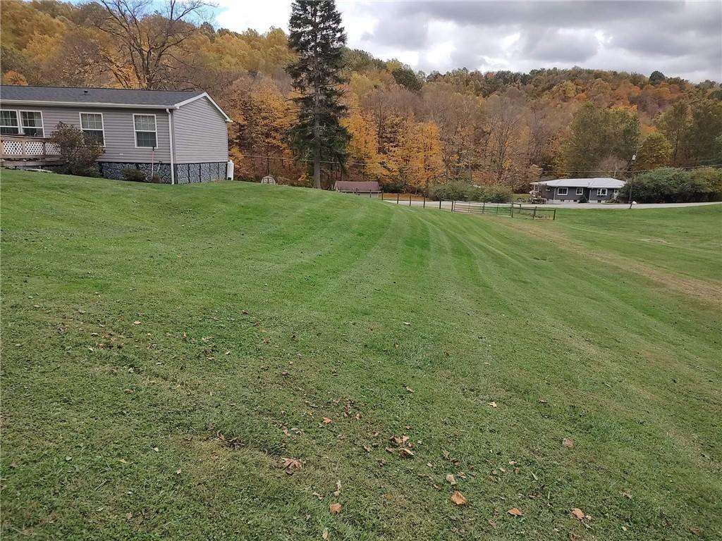 188 Cope Road Perryopolis, PA 15473 - Photo 19 of 21 a view of a house with a yard
