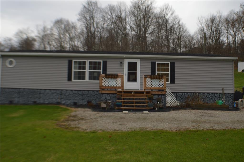 188 Cope Road Perryopolis, PA 15473 - Photo 20 of 21 a front view of a house with a garden