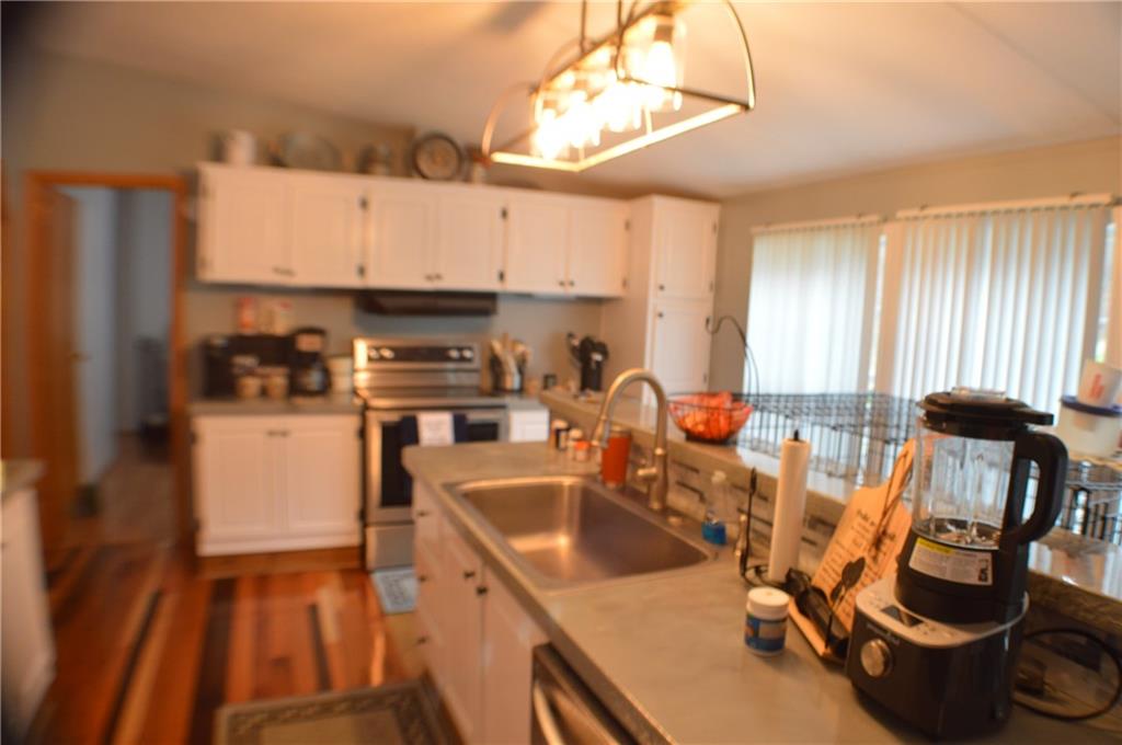 188 Cope Road Perryopolis, PA 15473 - Photo 5 of 21 a kitchen with a sink appliances and cabinets