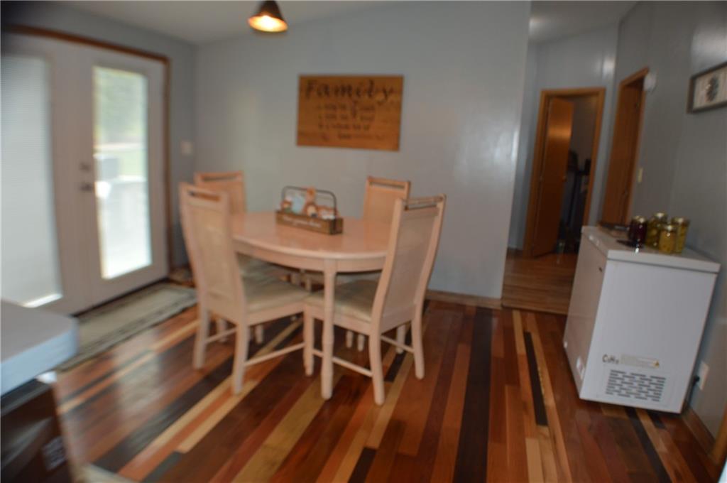 188 Cope Road Perryopolis, PA 15473 - Photo 6 of 21 a view of a dining room with furniture and wooden floor