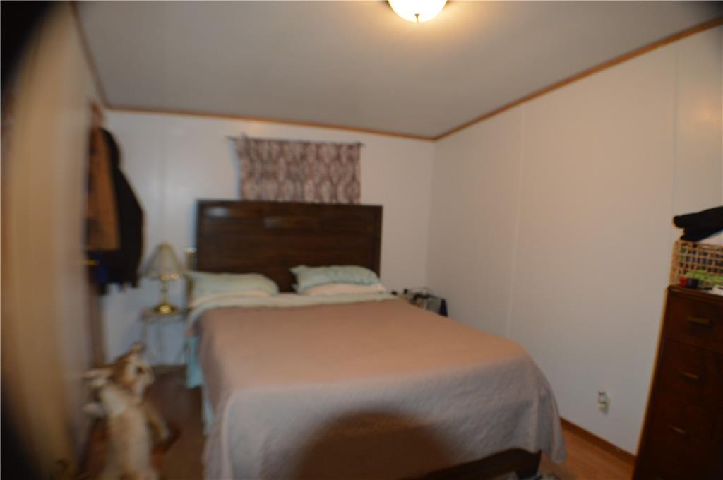 188 Cope Road Perryopolis, PA 15473 - Photo 10 of 21 a bedroom with a bed and flat screen tv