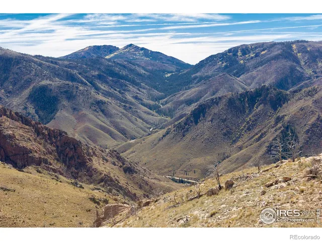 a view of ocean and a mountain