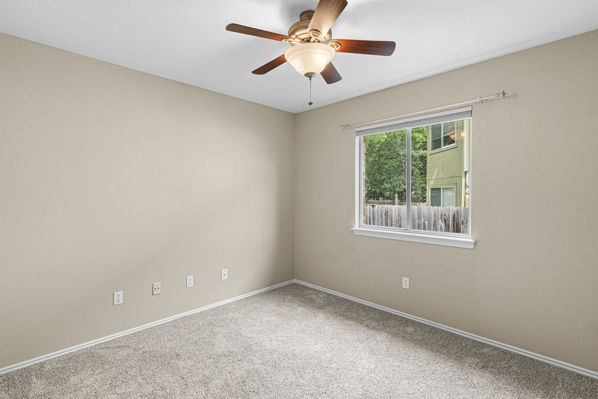 7172 Ridge Oak Road Austin, TX 78749 - Photo 36 of 40 A well-proportioned bedroom with ample natural light and a comforting ceiling fan.