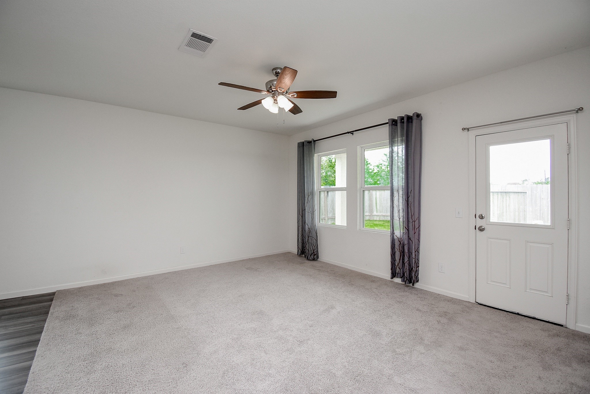 13542 Kinsman Road Houston, TX 77049 - Photo 14 of 43 a view of an empty room with a window