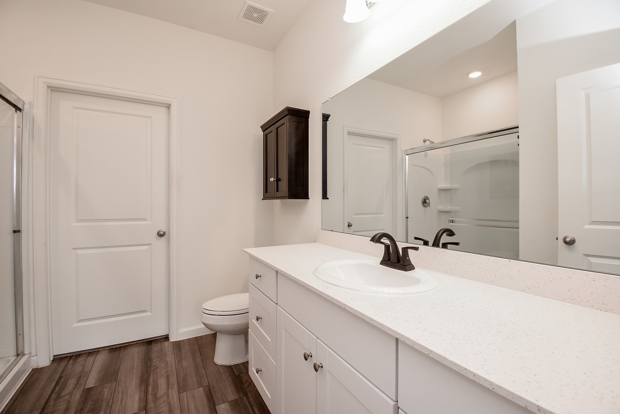 13542 Kinsman Road Houston, TX 77049 - Photo 19 of 43 a bathroom with a sink a toilet and a mirror