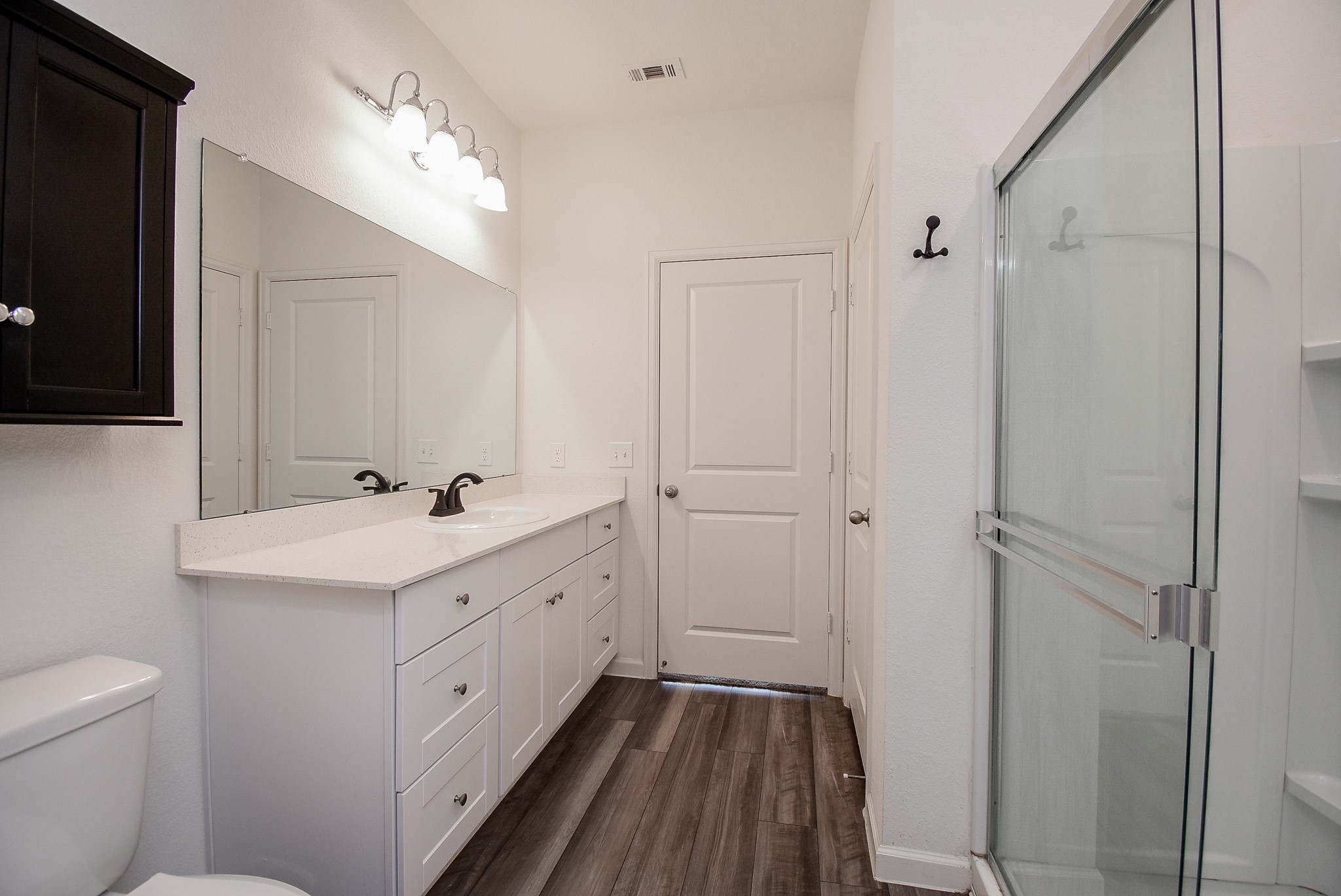 13542 Kinsman Road Houston, TX 77049 - Photo 20 of 43 a bathroom with a sink a toilet and shower
