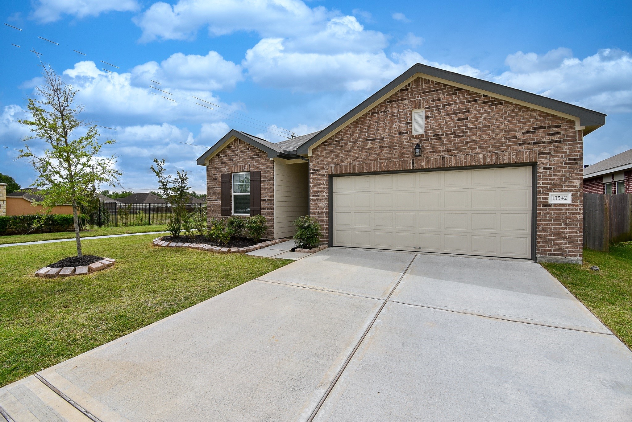 13542 Kinsman Road Houston, TX 77049 - Photo 2 of 43 a front view of a house with a yard