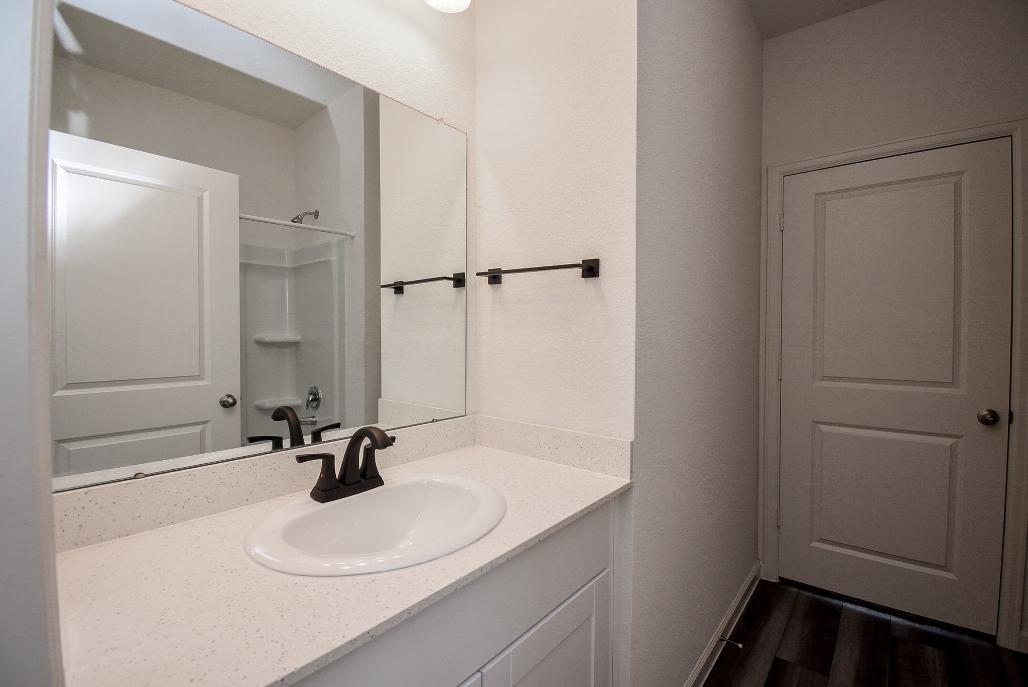 13542 Kinsman Road Houston, TX 77049 - Photo 28 of 43 a bathroom with a sink a toilet and a mirror