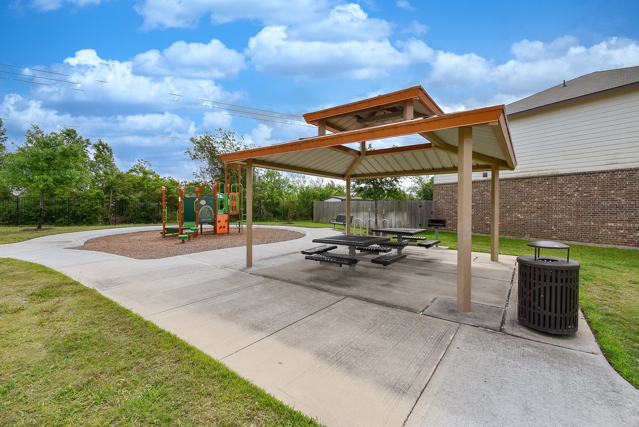 13542 Kinsman Road Houston, TX 77049 - Photo 41 of 43 a view of a patio with a table and chairs under an umbrella