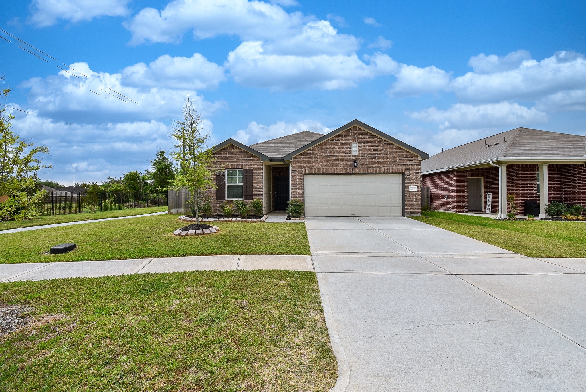 13542 Kinsman Road Houston, TX 77049 - Photo 42 of 43 a front view of a house with a yard