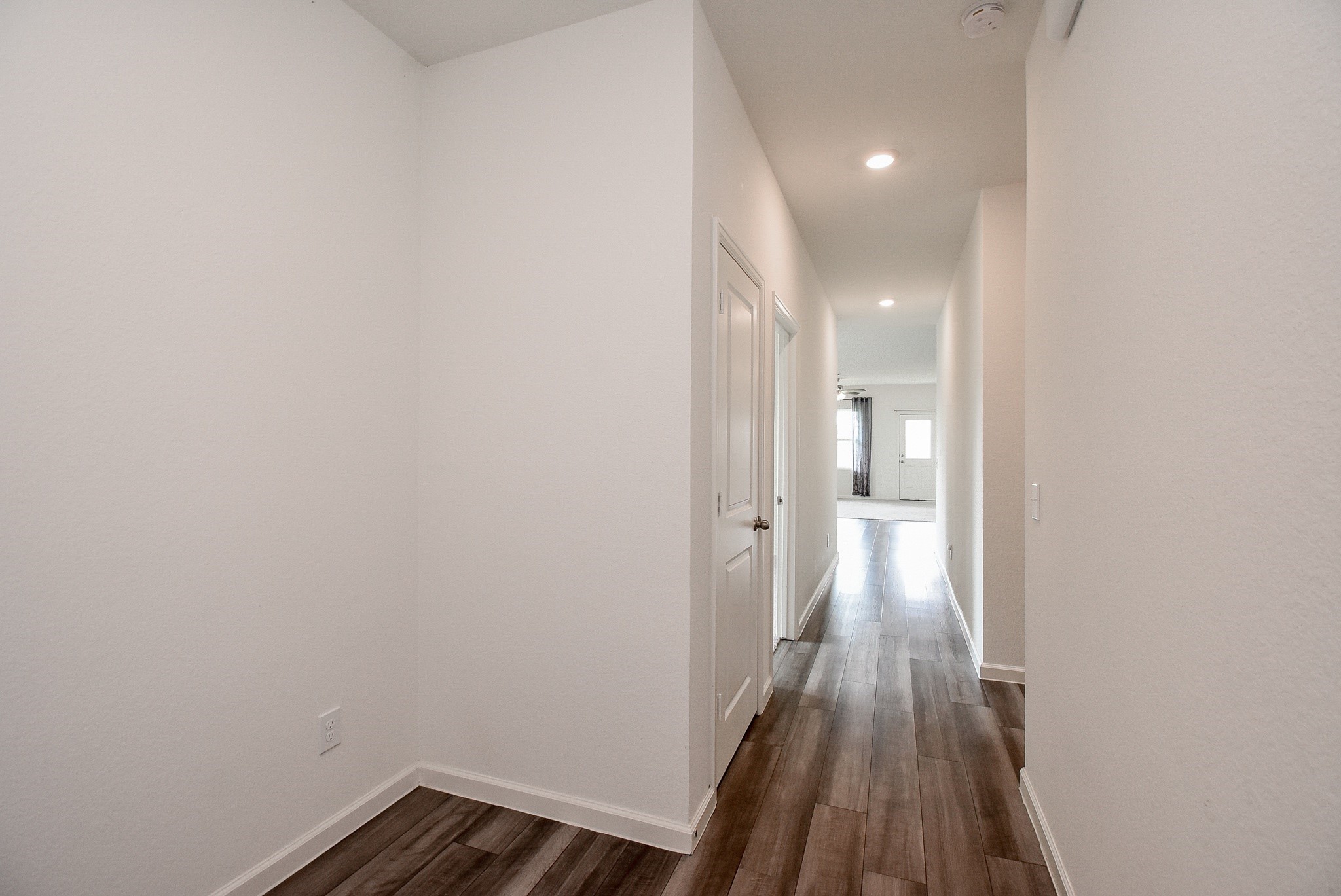 13542 Kinsman Road Houston, TX 77049 - Photo 5 of 43 a view of a hallway with wooden floor