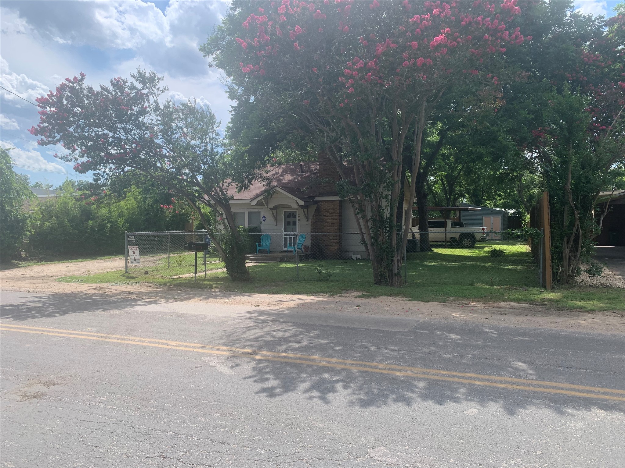 4204 Clawson Road Austin, TX 78704 - Photo 2 of 4 a view of a house with a big yard and large trees
