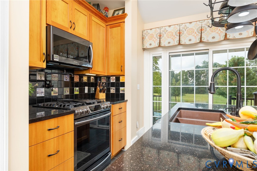 2284 Wallace's Bridge Road Lunenburg, VA 23952 - Photo 12 of 89 Kitchen featuring a copper-tone sink, black speckl