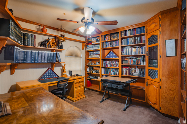 980 Cactus Circle St. George, UT 84790 - Photo 27 of 77 Office area with dark carpet, built in desk, ceiling fan, and ornamental molding