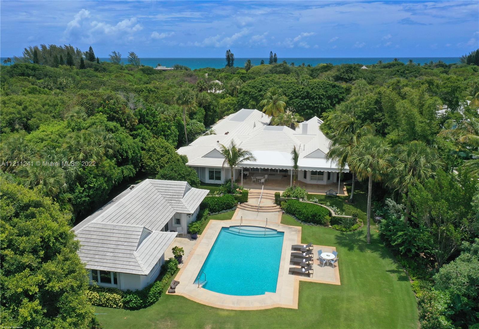 318 South Beach Road Hobe Sound, FL 33455 - Photo 13 of 69 an aerial view of a house with a yard and lake view