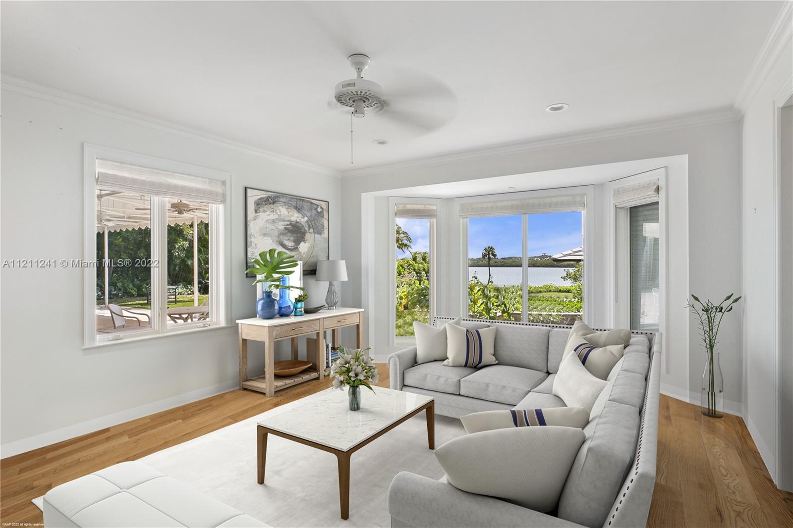 318 South Beach Road Hobe Sound, FL 33455 - Photo 33 of 69 a living room with furniture and a large window