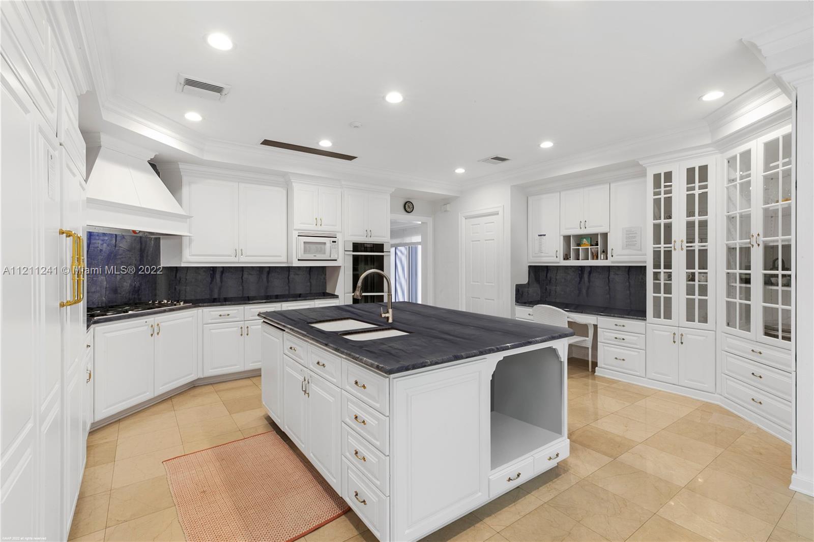 318 South Beach Road Hobe Sound, FL 33455 - Photo 36 of 69 a kitchen that has a sink and a stove in it