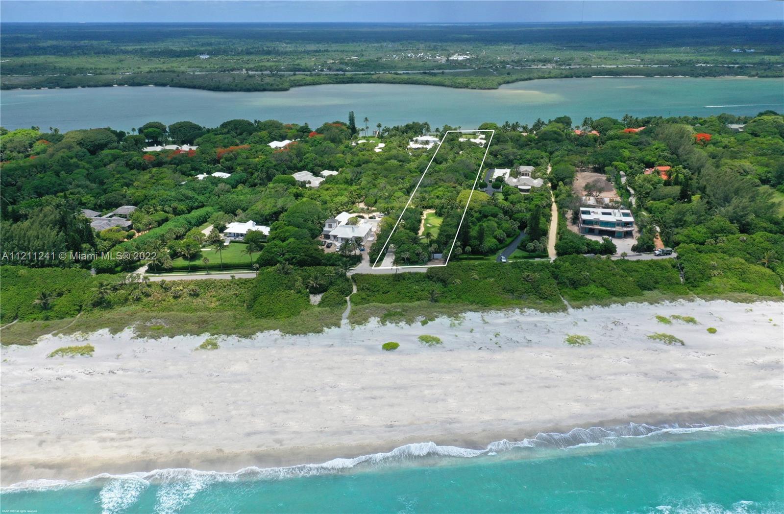 318 South Beach Road Hobe Sound, FL 33455 - Photo 4 of 69 a view of a lake with a park