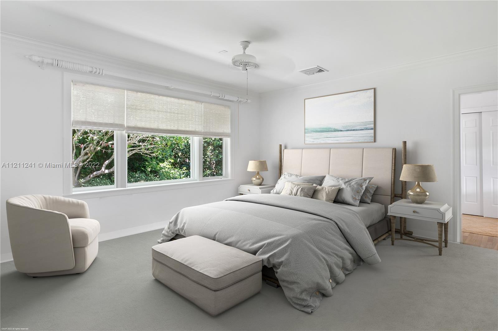 318 South Beach Road Hobe Sound, FL 33455 - Photo 43 of 69 a bedroom with bed and a large window