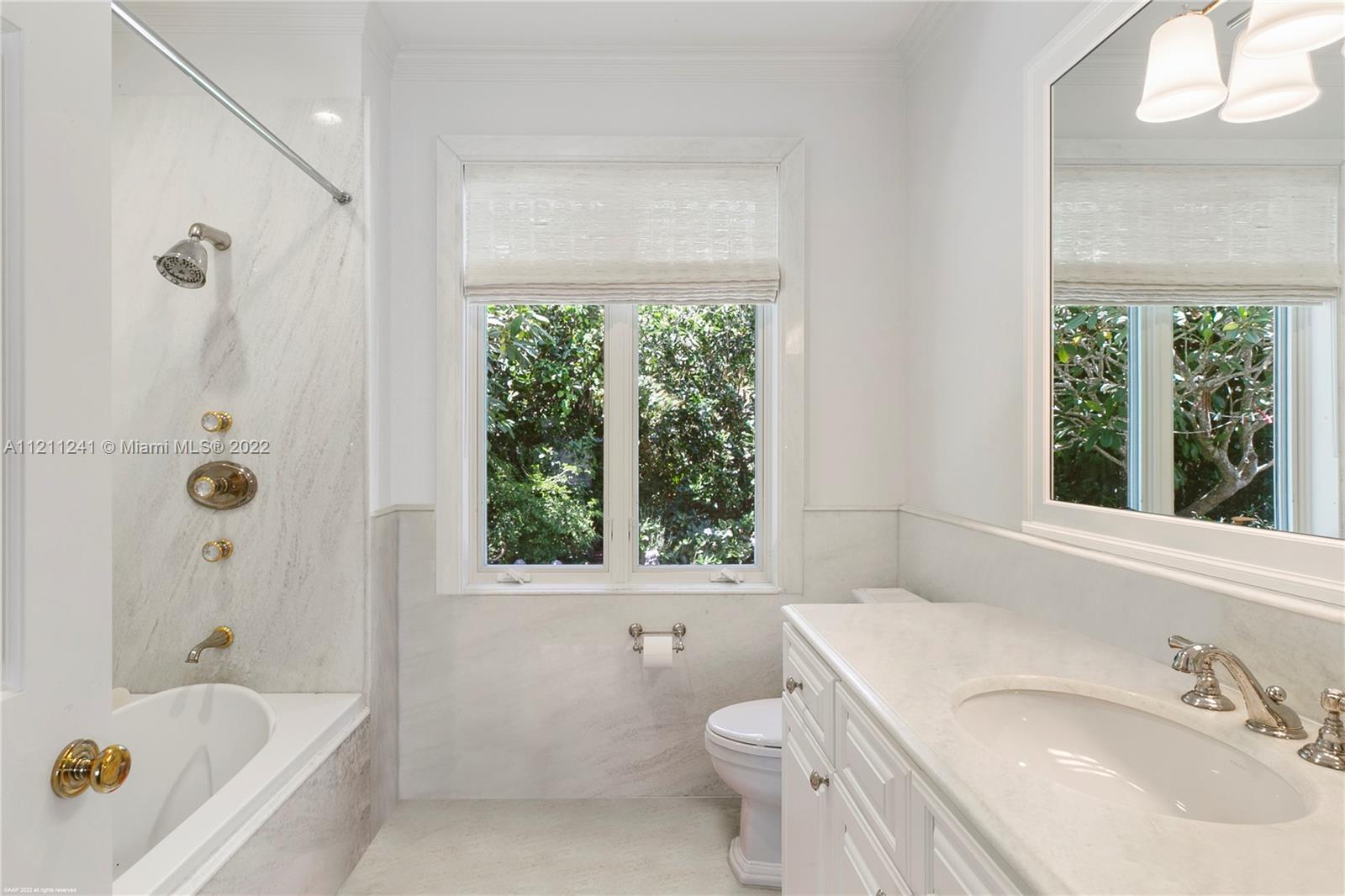 318 South Beach Road Hobe Sound, FL 33455 - Photo 44 of 69 a bathroom with a sink a toilet and a bathtub