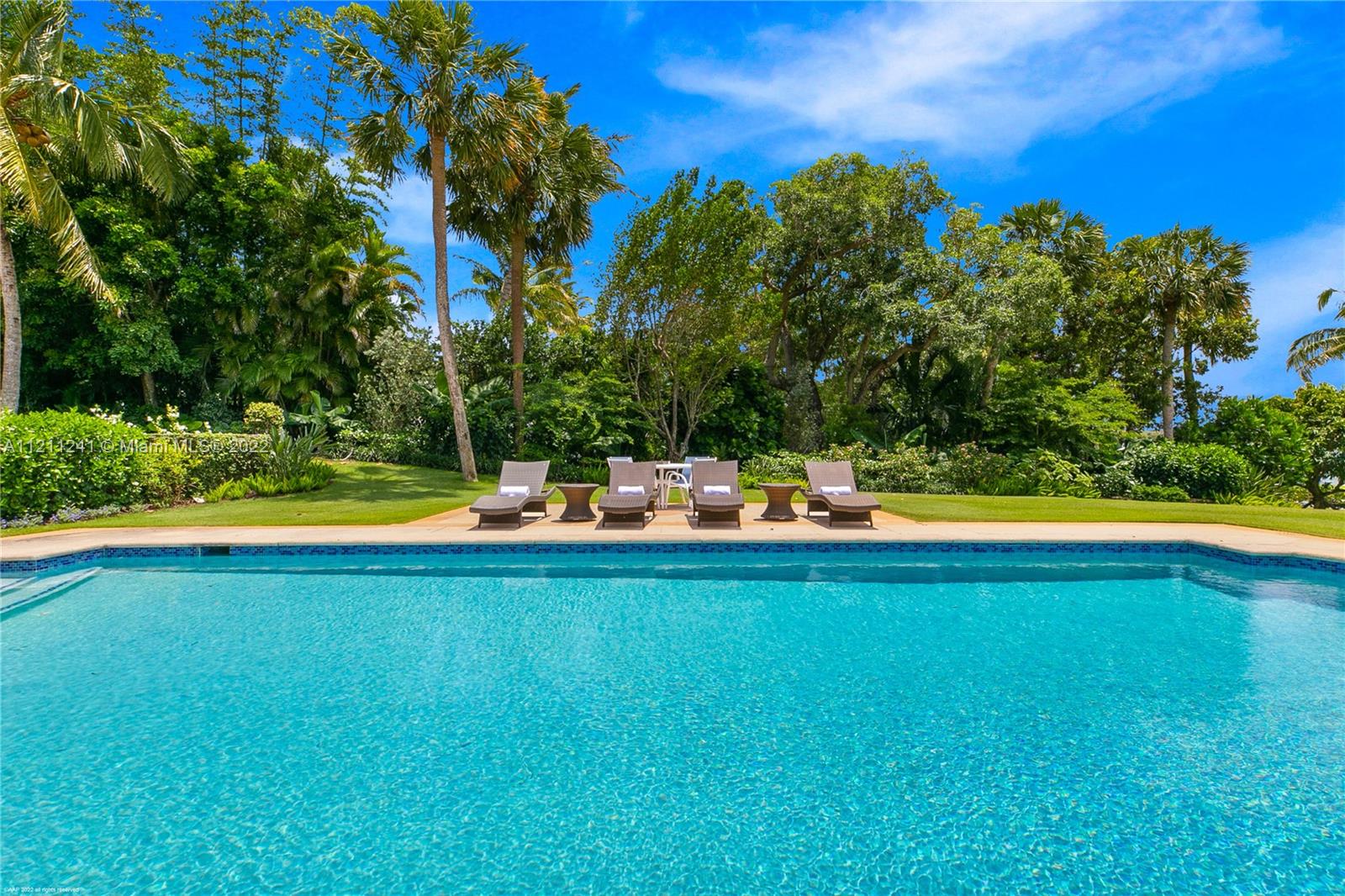 318 South Beach Road Hobe Sound, FL 33455 - Photo 61 of 69 a view of a swimming pool and a yard