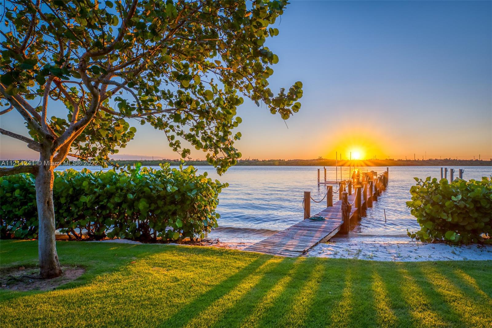 318 South Beach Road Hobe Sound, FL 33455 - Photo 64 of 69 a view of a garden with lawn chairs